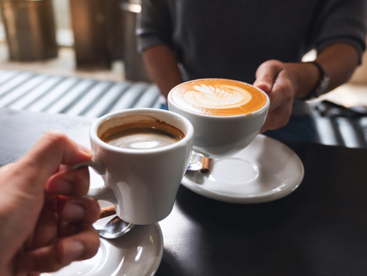 Couple enjoying romantic cups of Machismo Plus Morning Erection Blend coffee