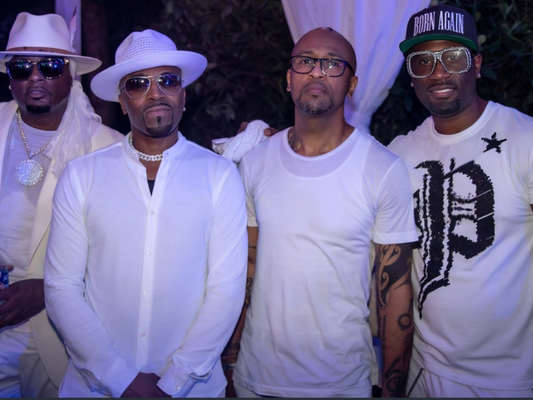 Group of men posing at an all white gay swinger party