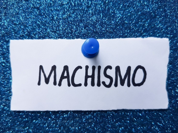 Machismo writing on blue background.