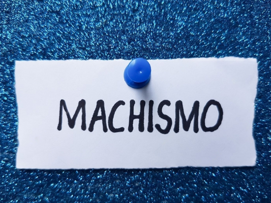 Machismo writing on blue background.