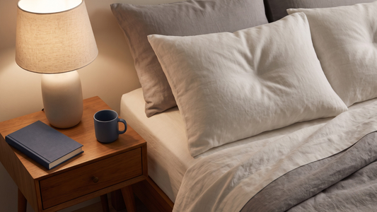 Calm bedside scene with lamp, book, and linens, representing a reassuring approach to premature ejaculation