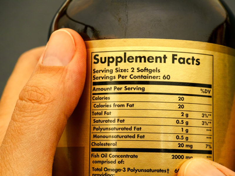 How to read a supplement facts label: Machismo Plus guide showing serving size, ingredient list, and daily values on a dietary supplement bottle